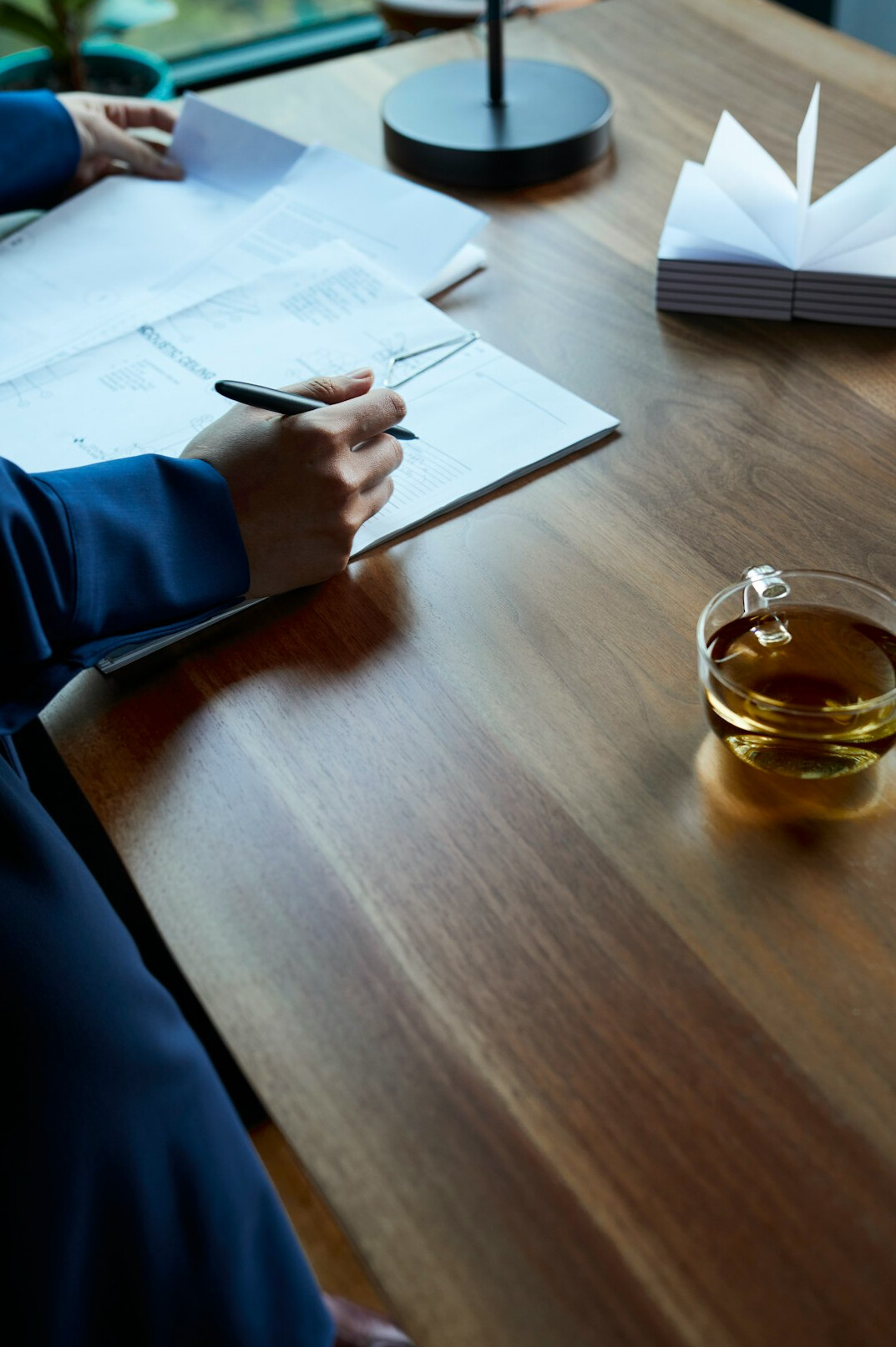 person reviewing bills at desk