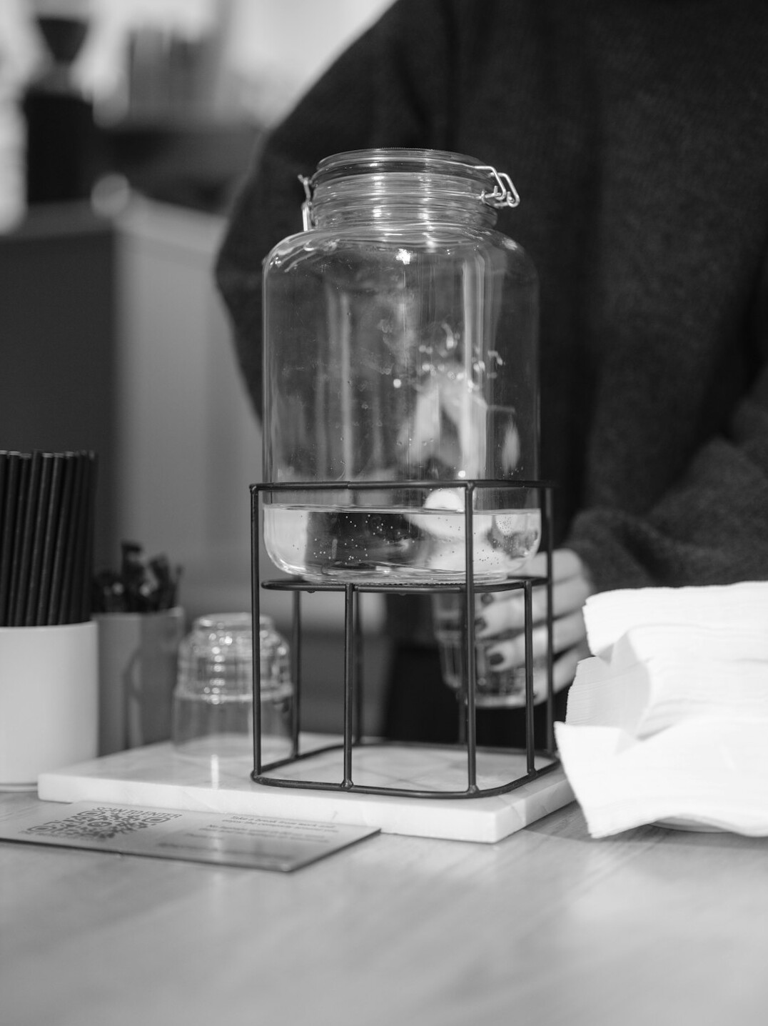 person saving money in jar
