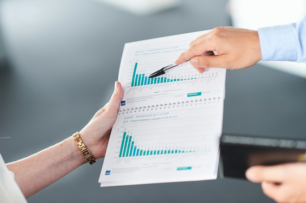 person reviewing financial reports